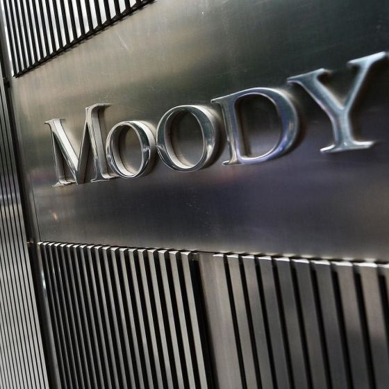 The front of the Moody's building is made of steel and has the company name on it.