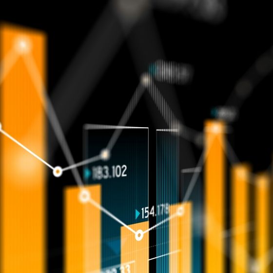 A graph with a bar chart and line chart in an orange color scheme with black background.