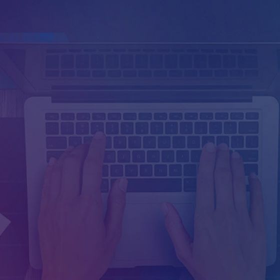 Person using laptop with tablet, cup of coffee, and papers on table with 32%, 17%, and 51% on left side