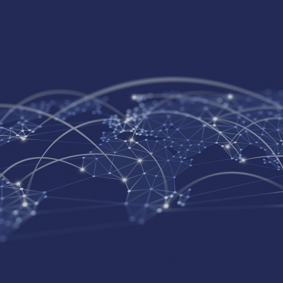 A blue background with a world map connected by white lines and dots, representing a global network.