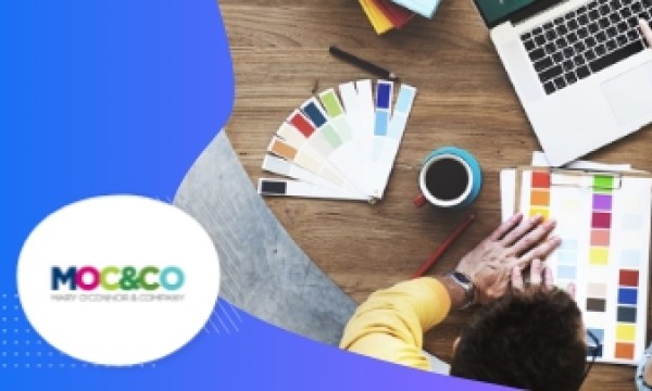 Mary O'Connor Company logo, a person with a laptop, and a color palette on a wooden table.