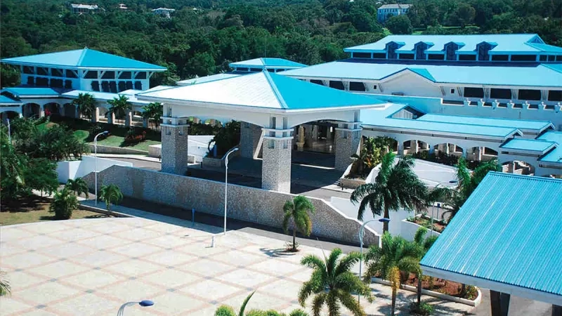 A section of the Montego Bay Convention Centre with its lush landscaping and blue-roofed architecture.