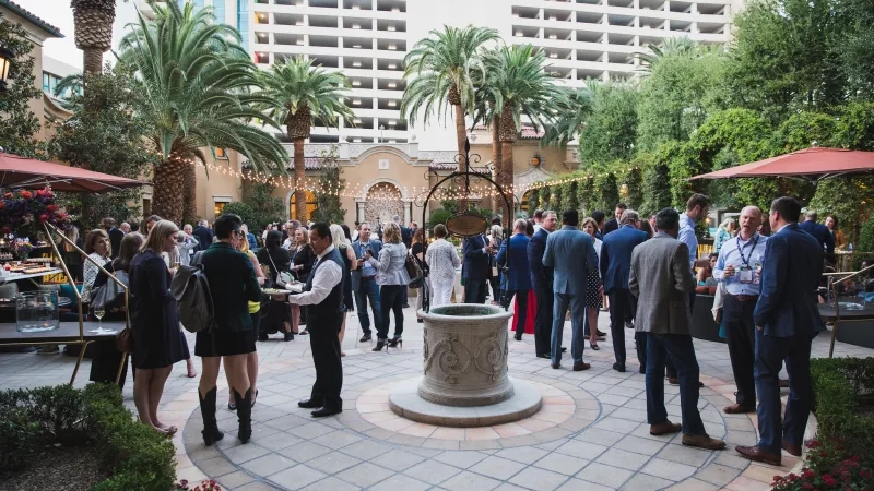 Group of people in formal attire at an outdoor event near the Showcase in Palm Springs.