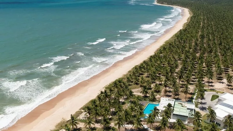 Aerial view of the beach, the ocean, and the resort in Brazil.