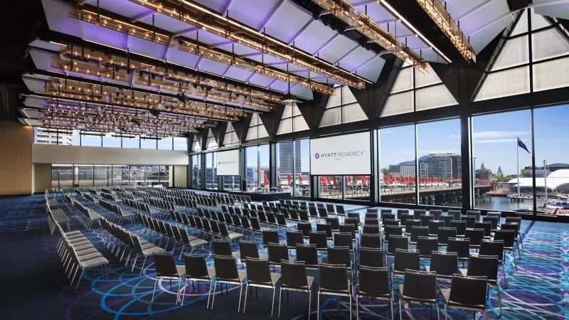 Conference room with chairs and a large window at Hyatt Regency Sydney.