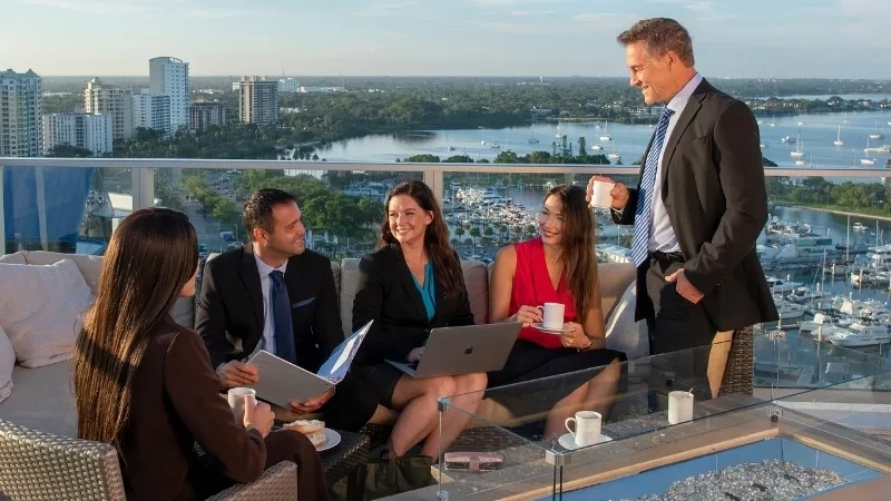 Group of people sitting on a couch with a view of the water at the W Fort Lauderdale.