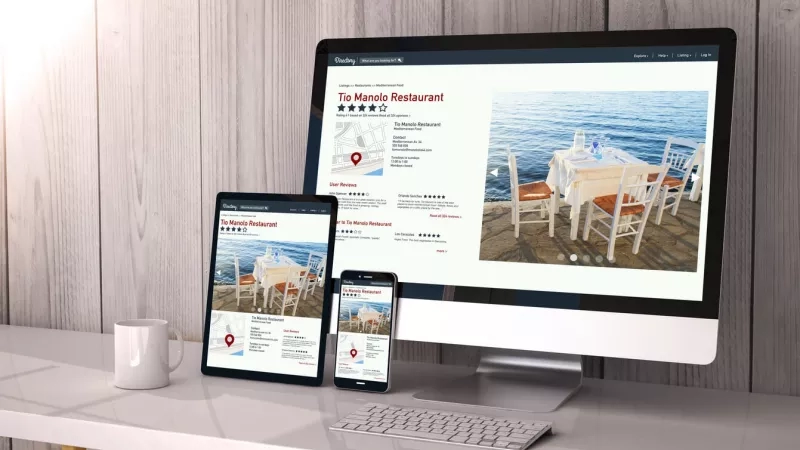 Computer, tablet and cell phone showing restaurant marketing materials and website.