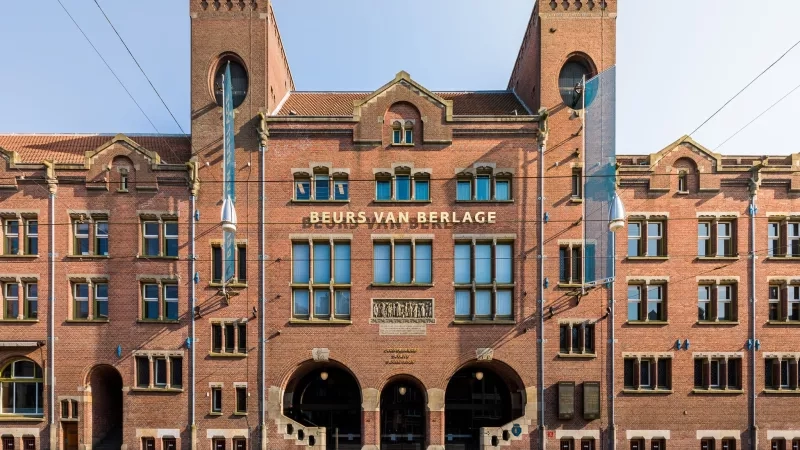 Exterior view of Beurs van Berlage showing its architecture, landscaping, and ambiance.