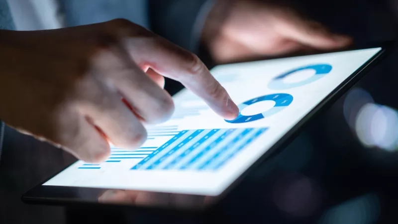 event planner looking at event trends data on tablet