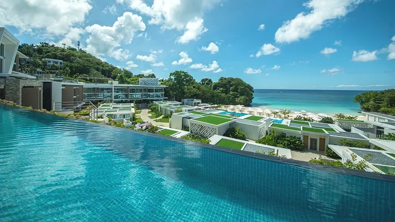 A view of the infinity pool and the beach from the rooftop of the resort.