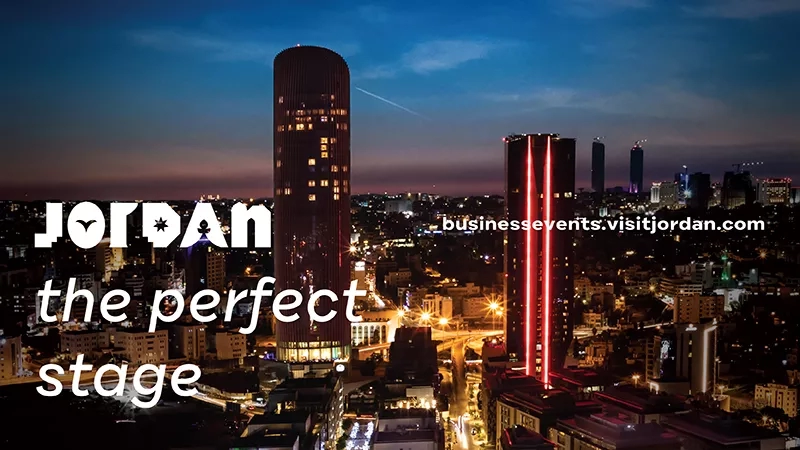 Jordan's city skyline at night, with a focus on architecture and the perfect stage text.