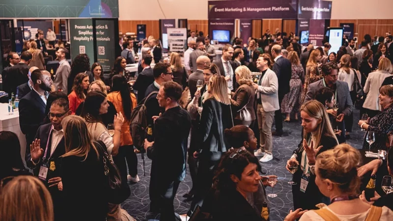 Crowded event marketing and management platform at the hospitality show with wine and beer glasses.