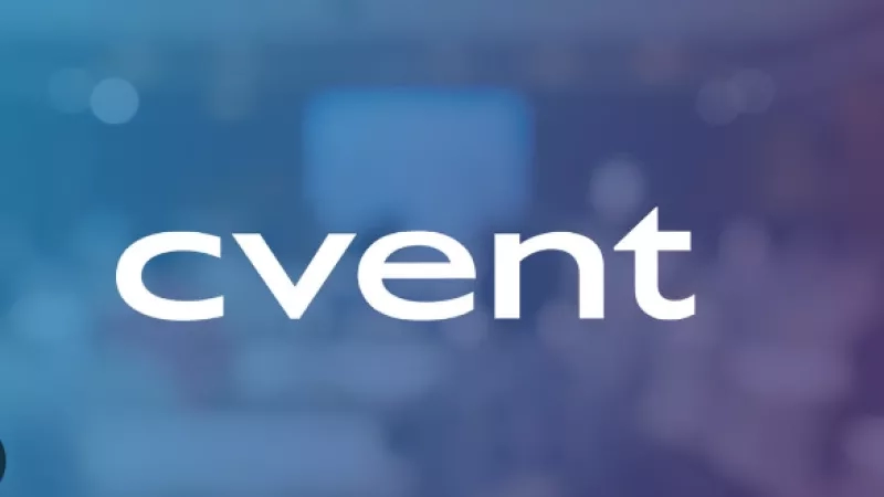 The Cvent logo with a blurred background of an office space.