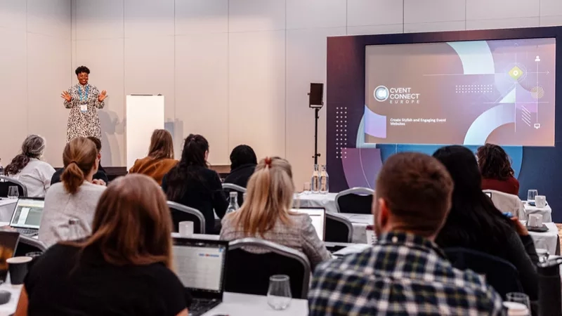 Speaker on stage in front of an audience at Cvent Connect Europe 2023 in London.