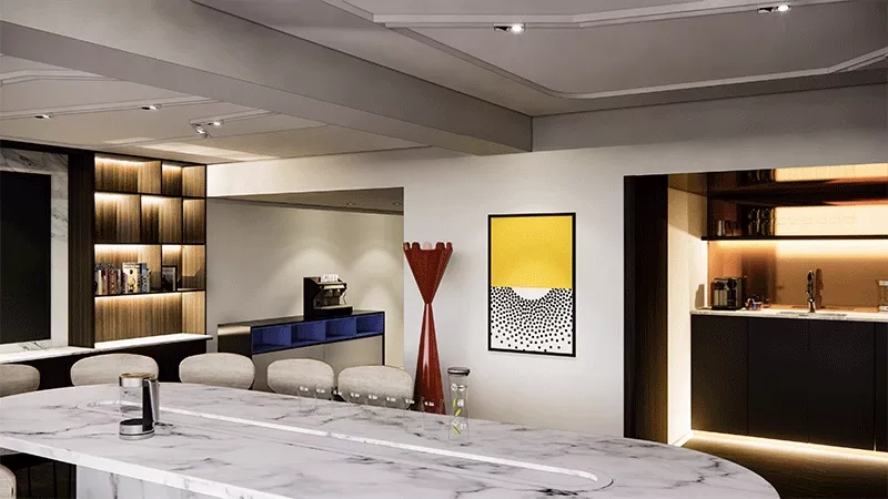 A kitchen with marble table, coffee machine, and a yellow and black painting on the wall.