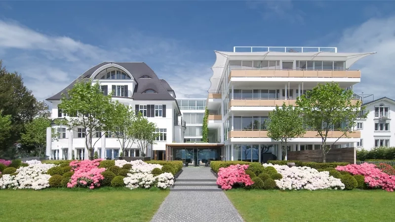 RIVA Das Hotel am Bodensee features modern architecture, lush landscaping, and a serene ambiance.