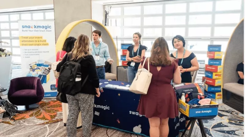 A group of people gathered at the snack magic event at the pop-up event.
