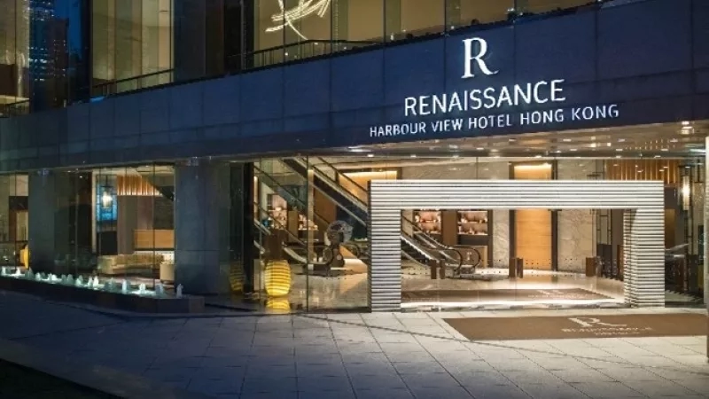 Harbour View Hotel Hong Kong with Renaissance text and illuminated night entrance and landscaping.
