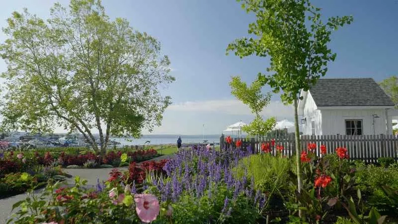A house at the lakefront with a wooden fence and beautiful garden at The Lake Club.