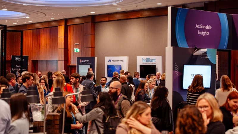 A crowd of people attending the Cvent CONNECT Europe 2024 trade show inside a conference room.