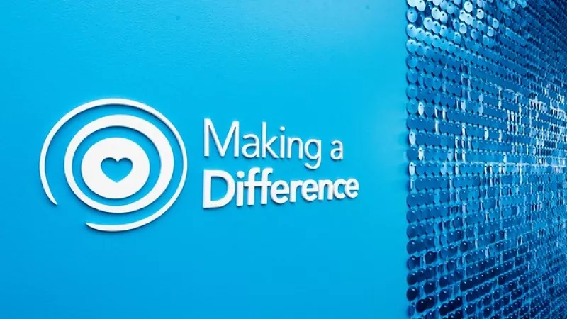 Blue wall with "Making a Difference" text and heart logo.
