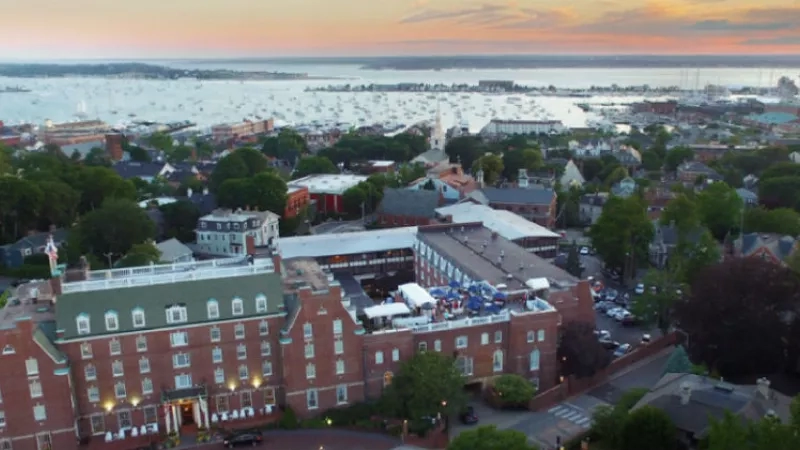 Aerial view of the town of Newport, Rhode Island, at dusk with the Newport Marriott in the foreground.