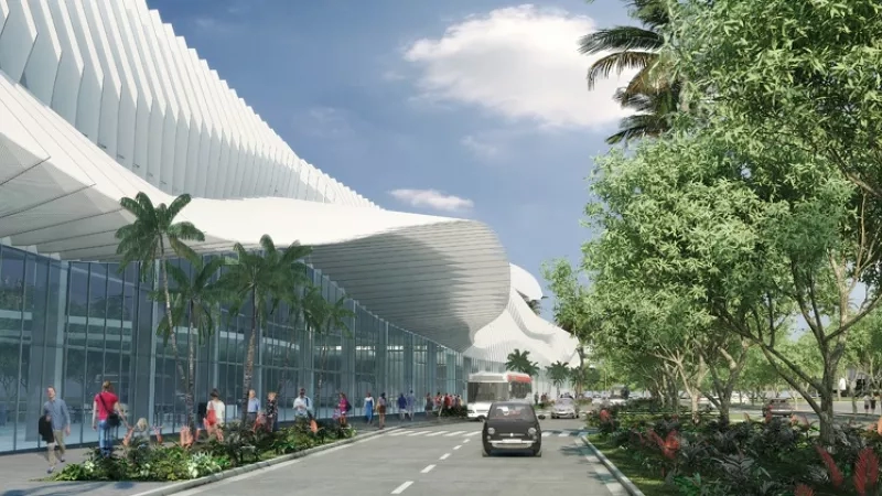 Exterior rendering of Miami Beach Convention Center main entrance with trees and people walking by.