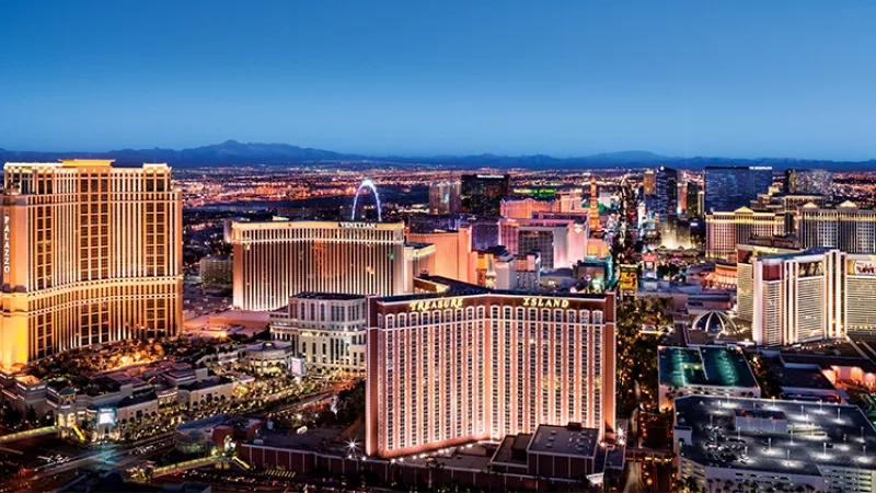 A nighttime view of Treasure Island Hotel and Casino in Las Vegas, Nevada, showcasing its illuminated architecture.