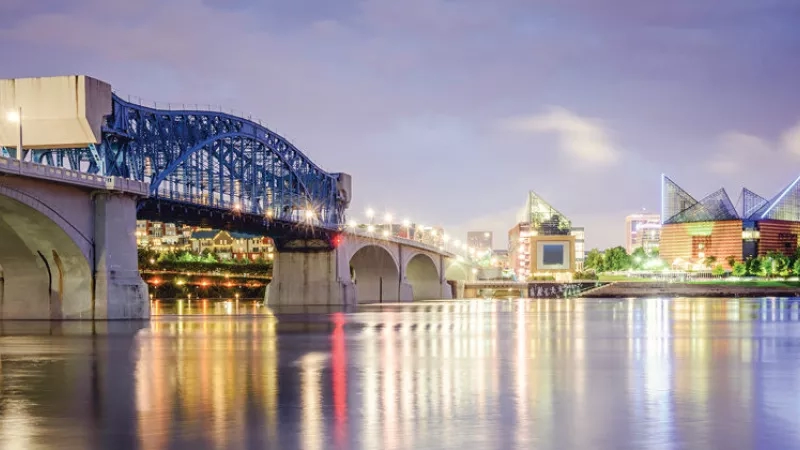 The Tennessee River at dusk with the Tennessee Aquarium and the Market Street Bridge in Chattanooga, Tennessee.