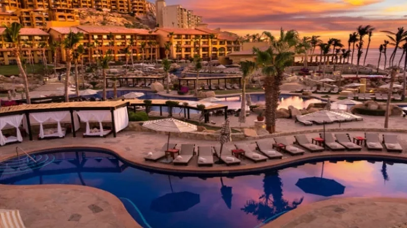 Sunset view of the pool at The Cape, A Thompson Hotel.