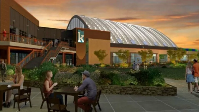 Kartrite Resort rendering of the outdoor with tables, chairs, building, stairs, trees, and people at dusk.