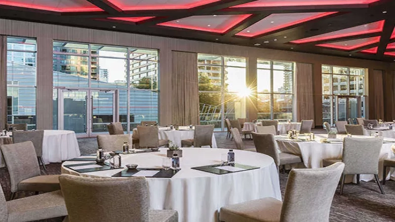 Trump Vancouver conference room with sun shining in from the window and tables set up for meetings.