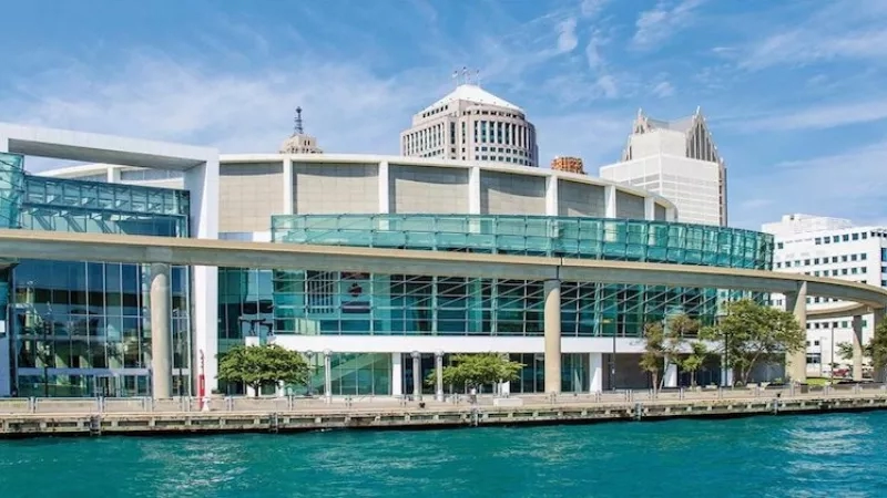 Waterfront view of the Huntington Convention Center of Cleveland with a city skyline in the background.
