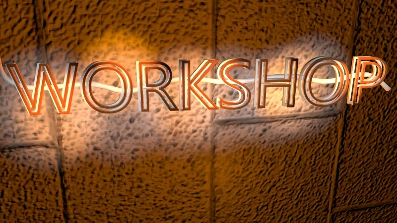 Abstract art with "Workshop" text glowing in orange against a textured brown background.