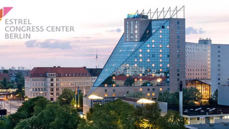 The Estrel Congress Center Berlin features modern architecture, lush landscaping, and a vibrant ambiance.