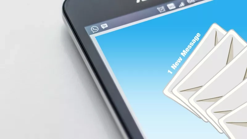 A smartphone displaying an inbox with one new message, highlighting the convenience of mobile communication.