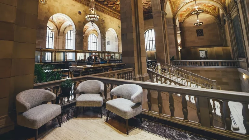 Inside the Philadelphia Museum of Art with chairs, staircase, and architectural details.