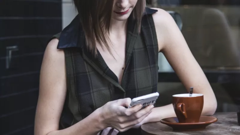 Woman social media marketing on cell phone