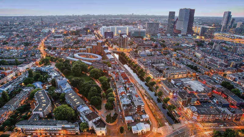 A top view of the city of the Hague in Netherlands with buildings and green spaces.