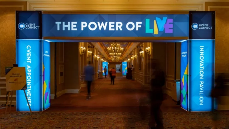 The Power of Live Event Connect event entrance with people walking in the hallway.