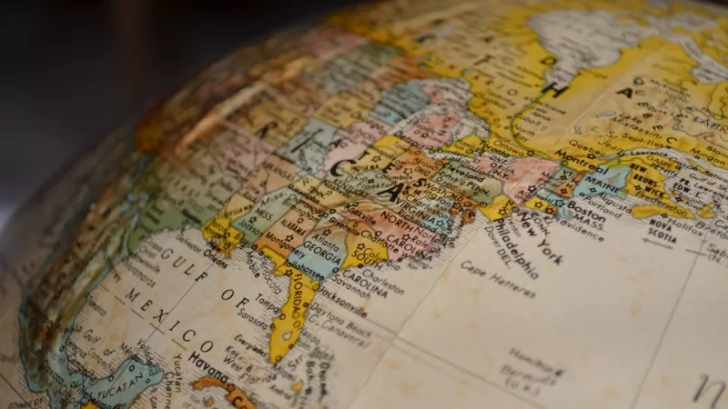 A globe with a focus on the United States and Canada with a vintage map design.