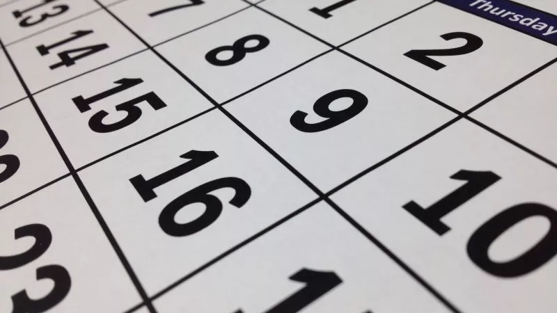 A close-up of a calendar showing the days of the week and the numbers 1 to 10.