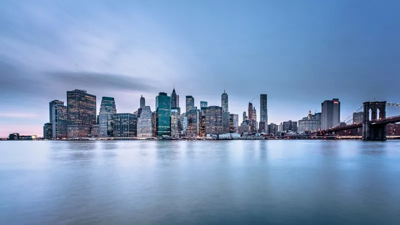 The Brooklyn Bridge, a stunning architectural marvel, stands majestically against the backdrop of the New York skyline.