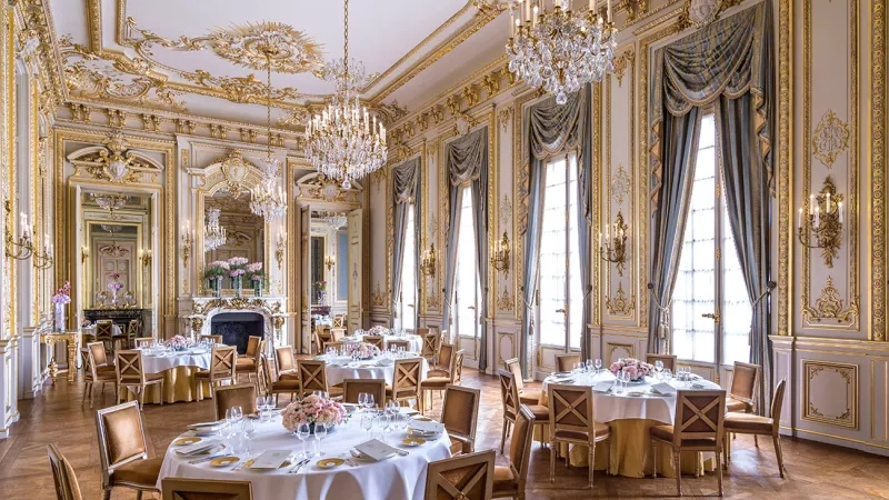 Salon Historique in Hotel Plaza Athenee Paris, a luxury hotel in France with a dining table set up.