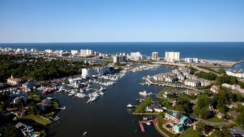 An aerial view of the marina with a blue ocean in the distance in Virginia Beach.