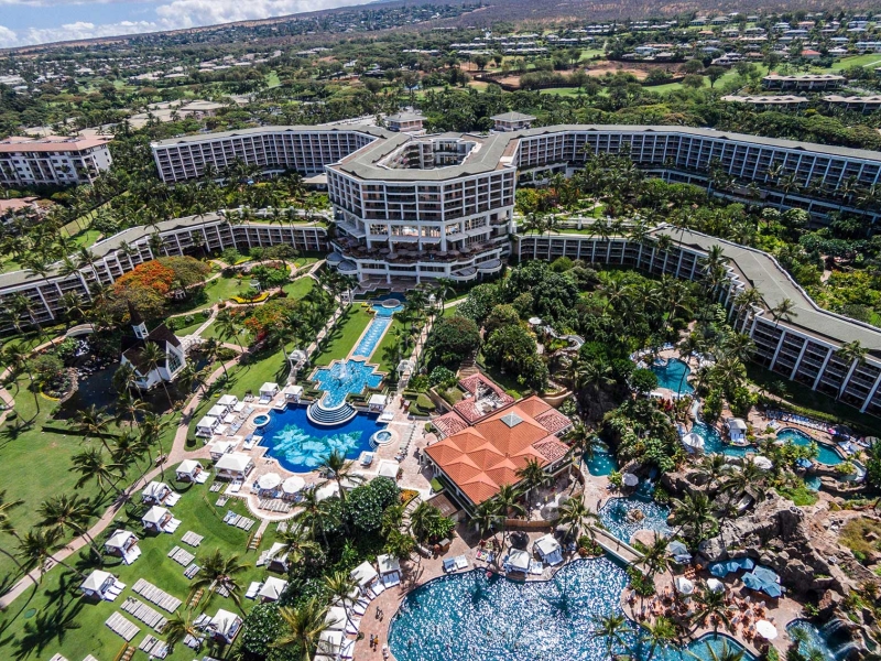 An aerial view of the Grand Wailea Resort Hotel and Spa with multiple pools and lush landscaping.