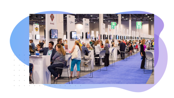 Exhibitor management header image of an event with many people and booths.